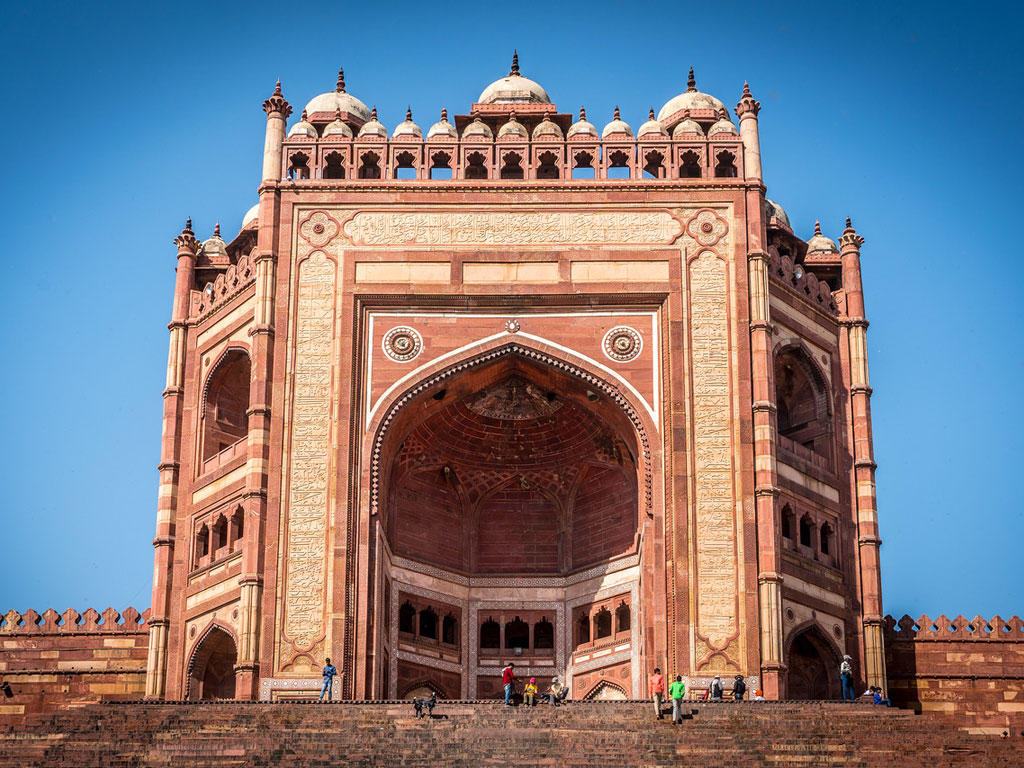 Front facing view of Fatehpur Sikri mid day with blue skies in background
