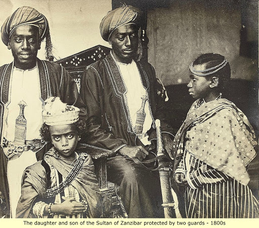 The Son and daughter of the Sultan of Zanzibar is protected by two guards, 1800s