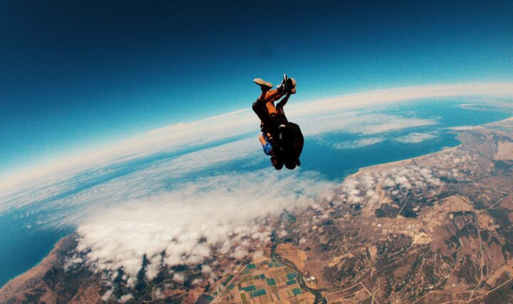 Person skydiving at daytime.