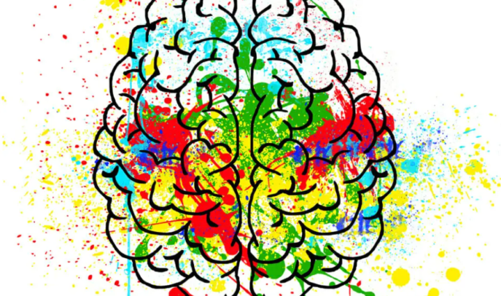 Kunstværk af hjerne i forskellig maling farve sprøjtede over lærred