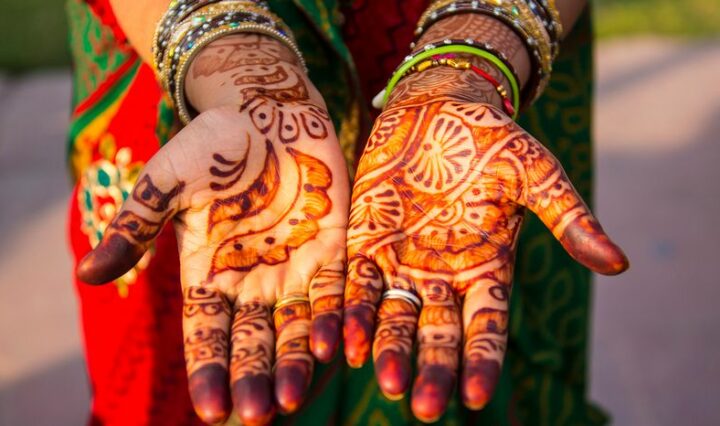 An Indian woman's palms painted with henna