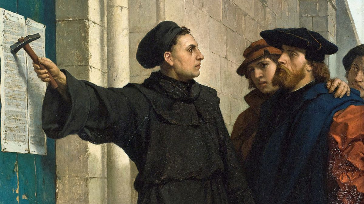 Martin Luther displaying the 95 Theses.