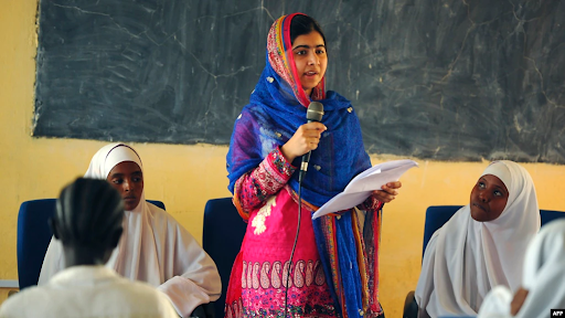 Pakistani Nobel Prize recipient and education activist Malala Yousafzai speaking in a classroom of girls