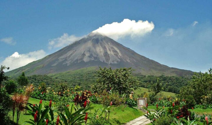 Arenal Volcano towering over the lush green countryside