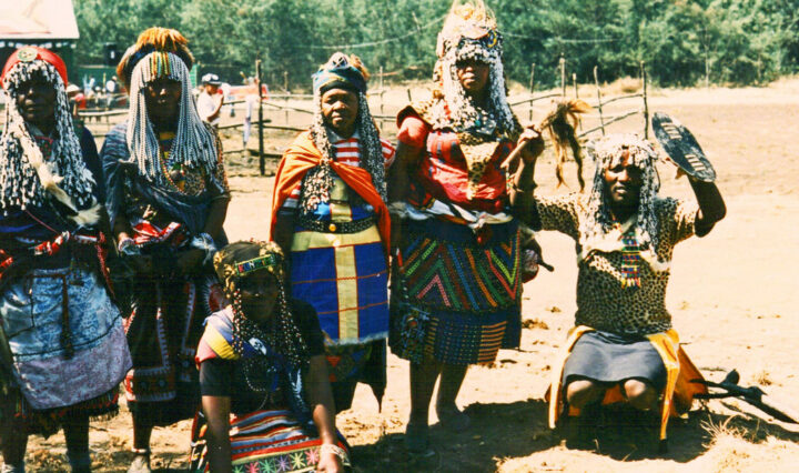 Five insangoma seen in an African village, dressed in traditional and culturally appropriate witch-doctor-wear.
