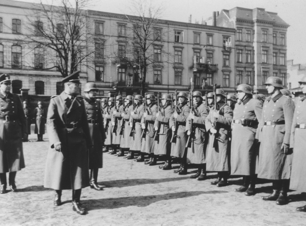 The German Order Police under Nazi officials' inspection.