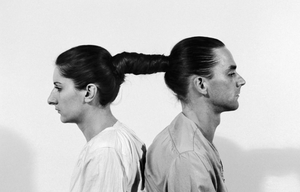 black and white picture of Marina Abramovic and Ulay, whose hair is tied to each other as if they were one head