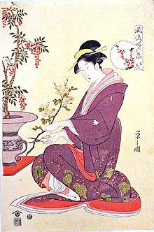 A lady practising ikebana: Woodcut ukiyo-e print by Eishi