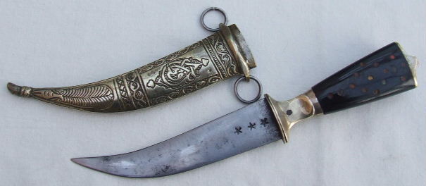 A dagger and a sheath, showing the small and intricacy of the weapons the Order of Assassins used.