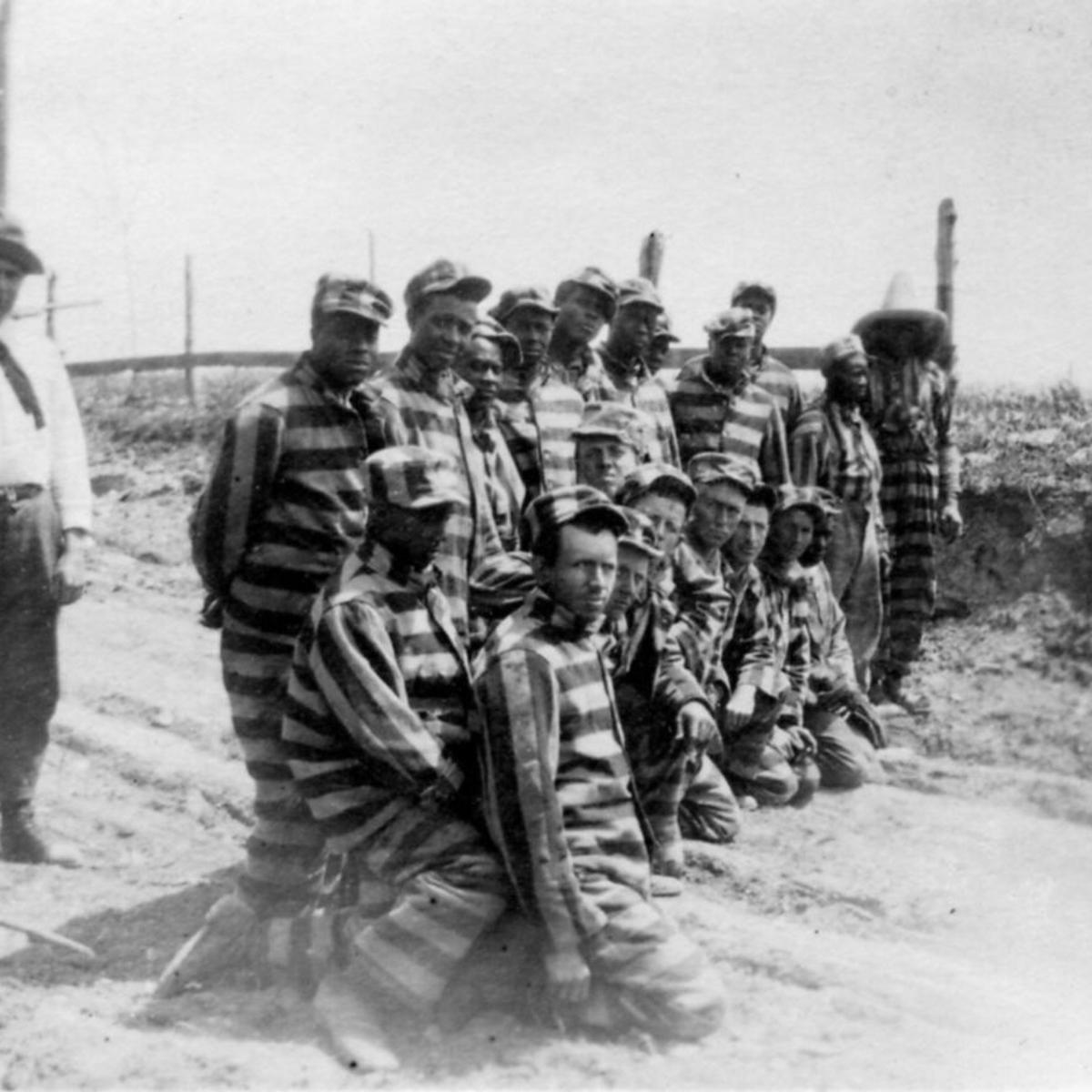 A photo of inmates working in a chain gang in the 1930s.