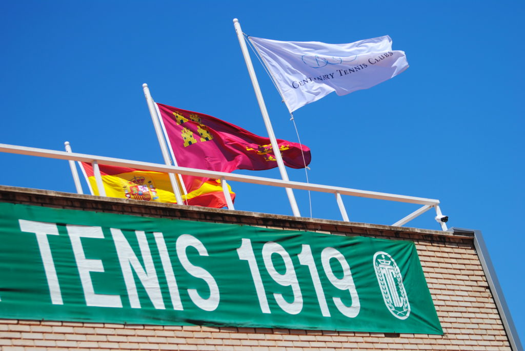 Tennis club in Alicante, Spain with the nations flag and regional one present.