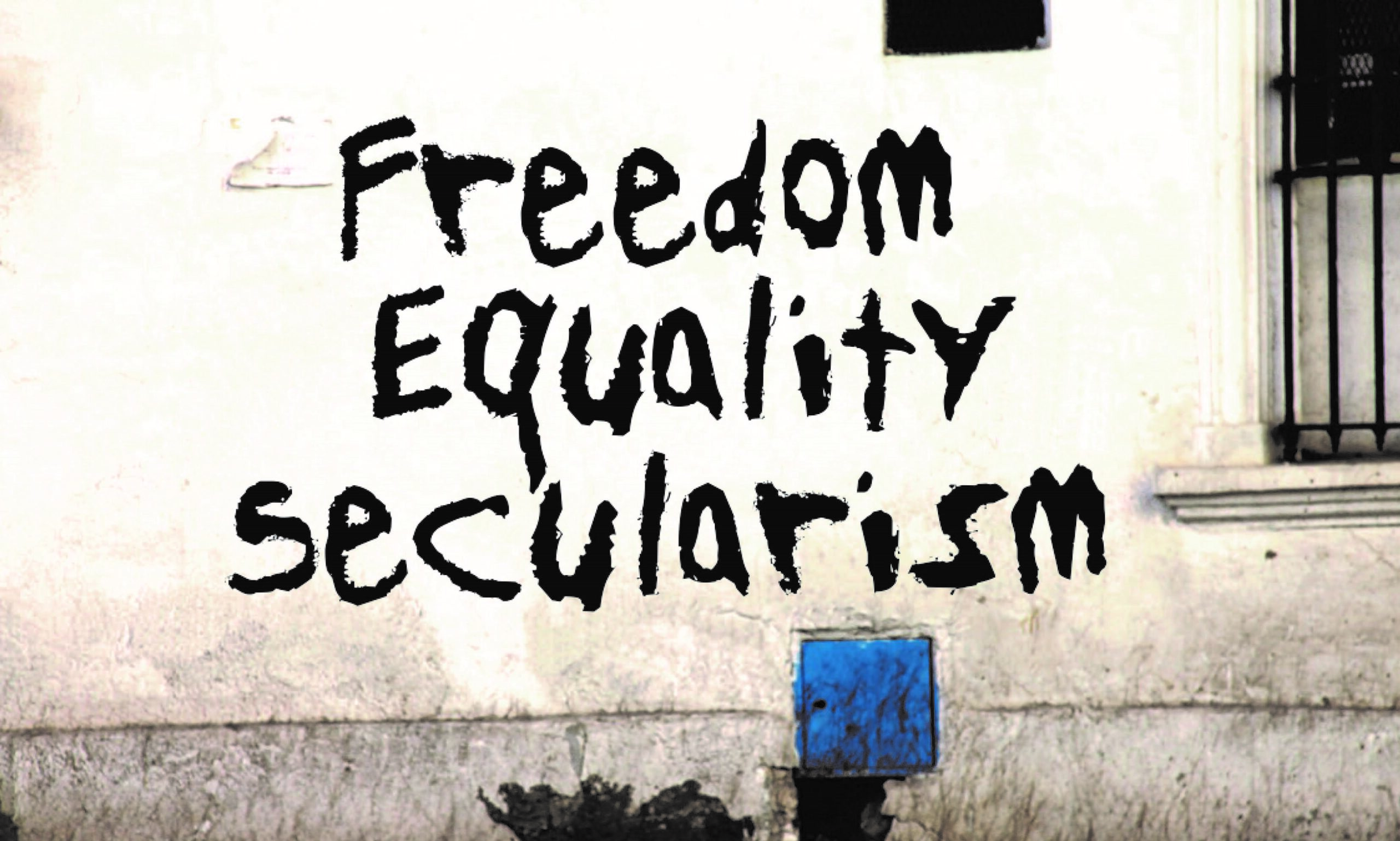 Image of writings on the wall saying ~"Freedom, Equality, Secularism"