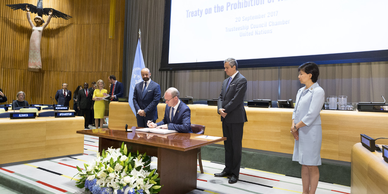 A photograph in colour showing world leaders signing the TPNW at the UN