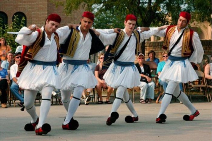 Traditional Greek dancers performing at the streets of Athens