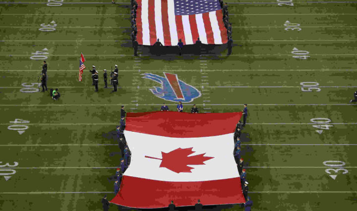 The American and Canadian flags unfurled during an NFL game