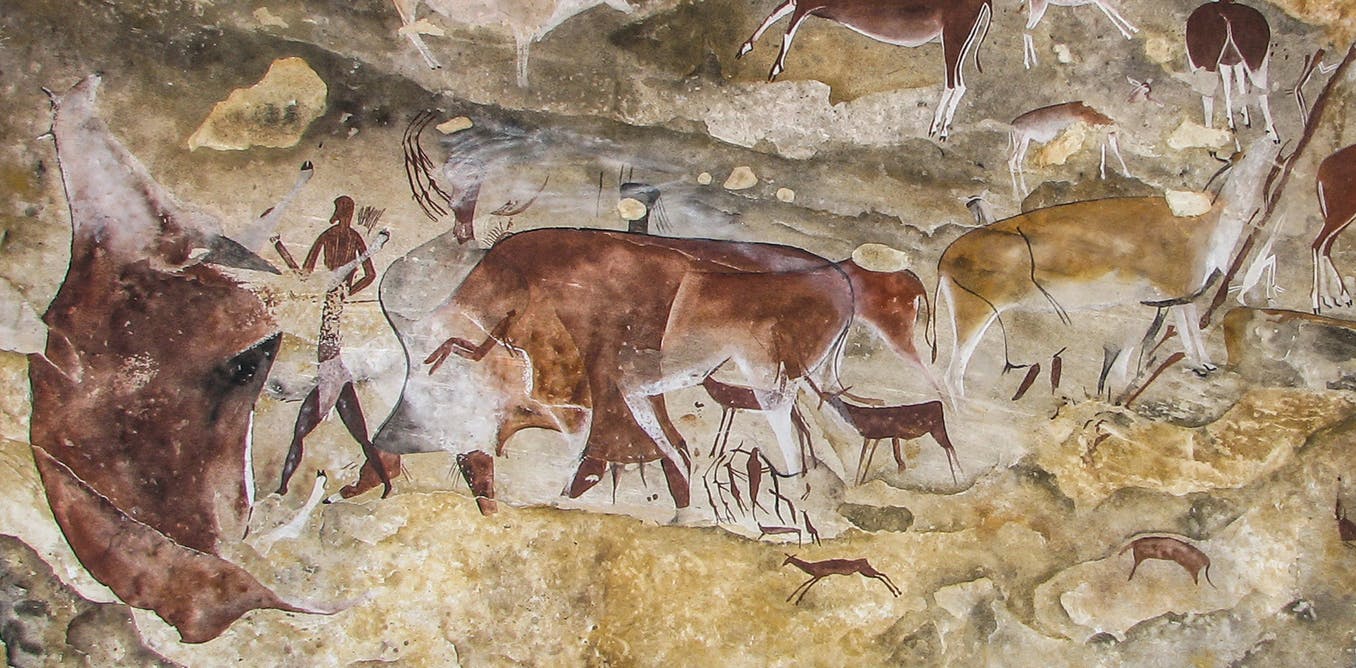 Ancient south african san rock art depicting cattle and people.