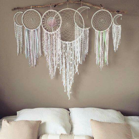 White dreamcatchers above the bed