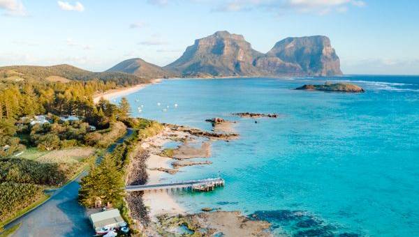 The coastline of Lord Howe Islandwith mountain peaks and a blue water bay is a perfect holiday destination.