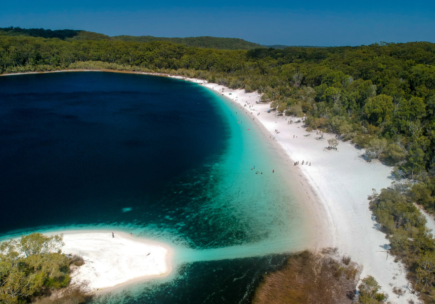 Fraser Islands Lake Mckenzie is a favourite for holiday makers with its dark blue clean water, white sand and surrounding bushland.