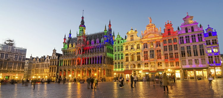 Buildings in Brussels lit up with rainbow colours, making it a safe place for LGBTQIA+ travelers.