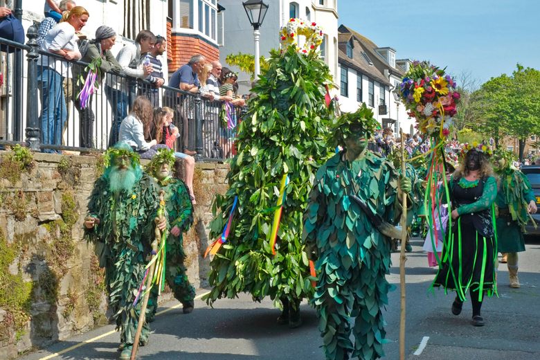 Colored image of the parade in Hastings, England for the Jack in the Green May Day