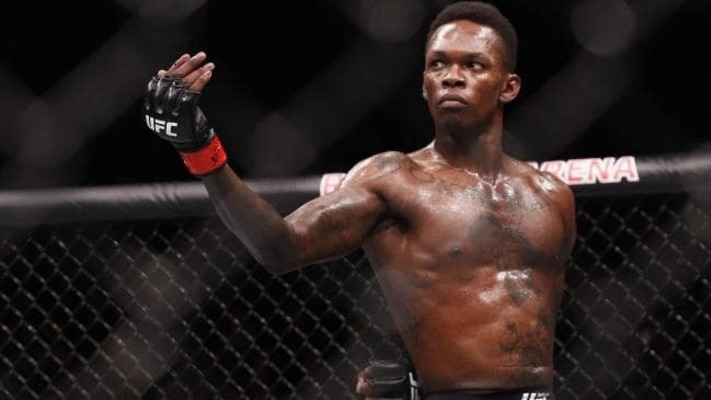 Israel Adesanya striking a pose during his fight with Anderson Silva.