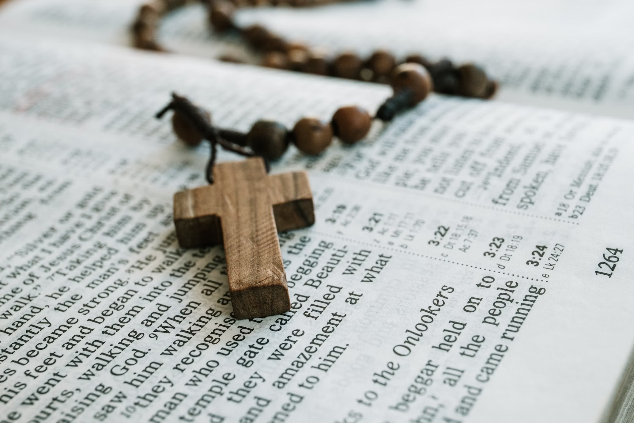 Cross Necklace laying on Bible